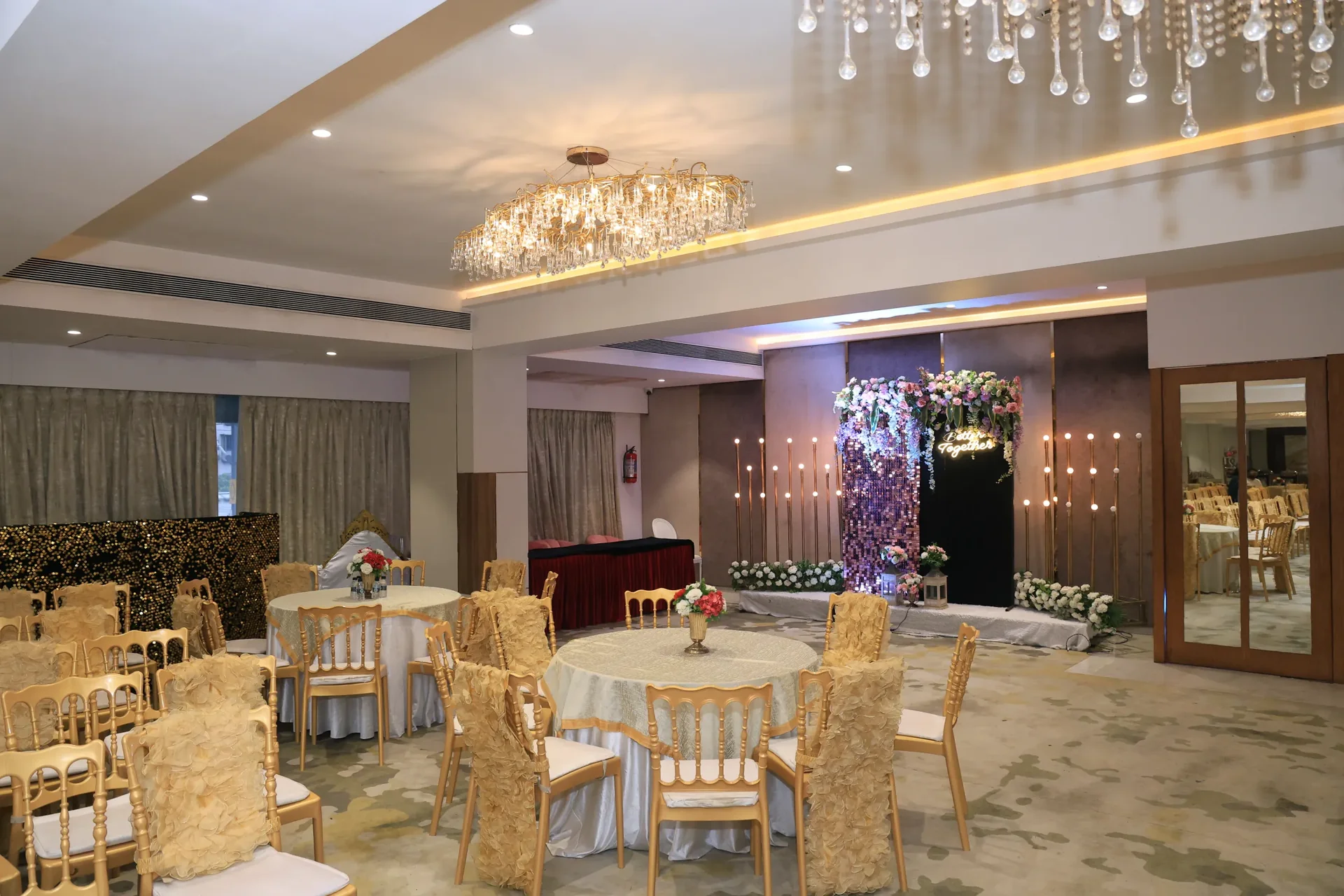 Wedding stage in gold and white at Golden Leaf Banquet, Malad