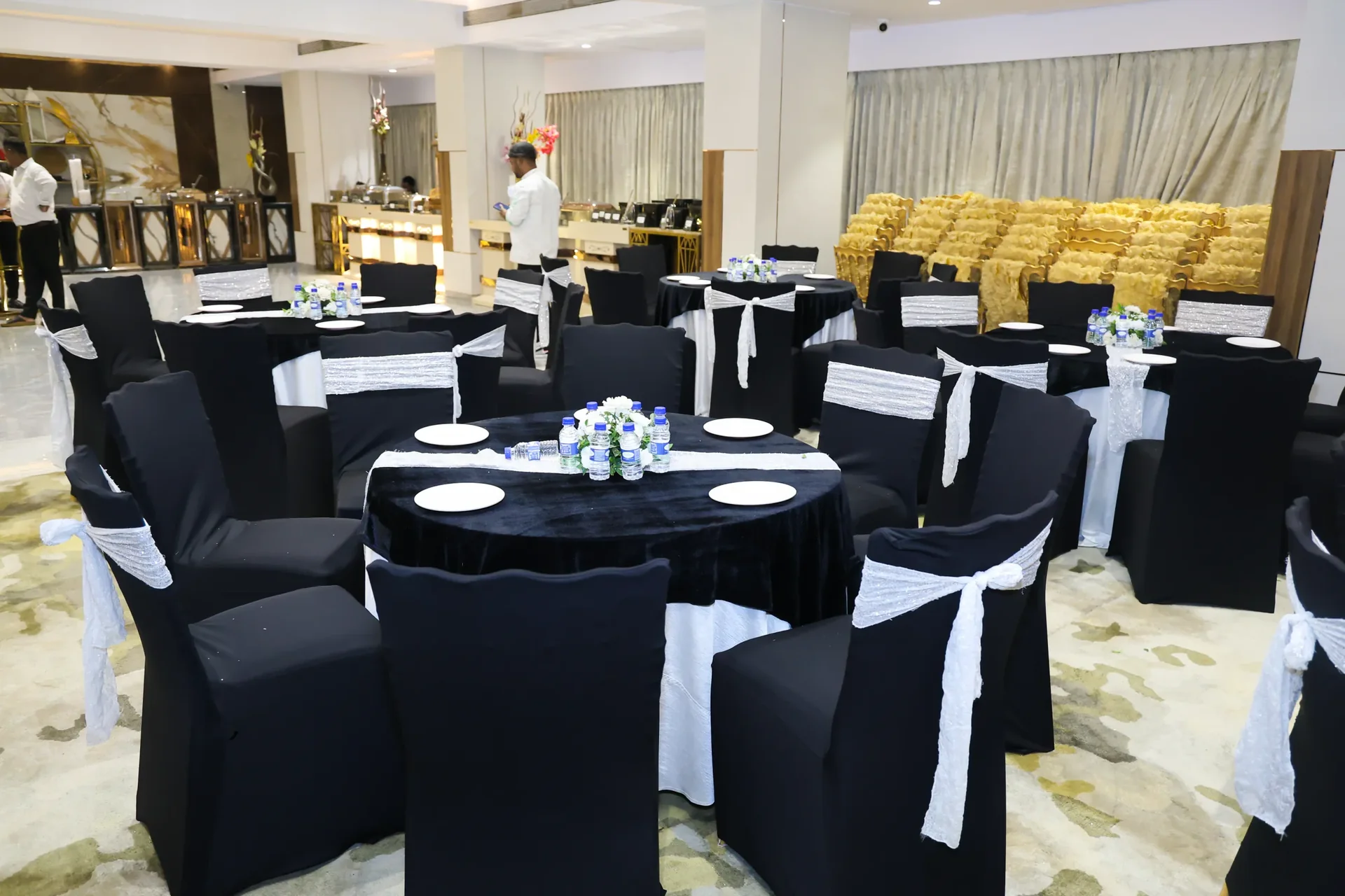 Dining hall set for a full-dress celebration at Golden Leaf Banquet